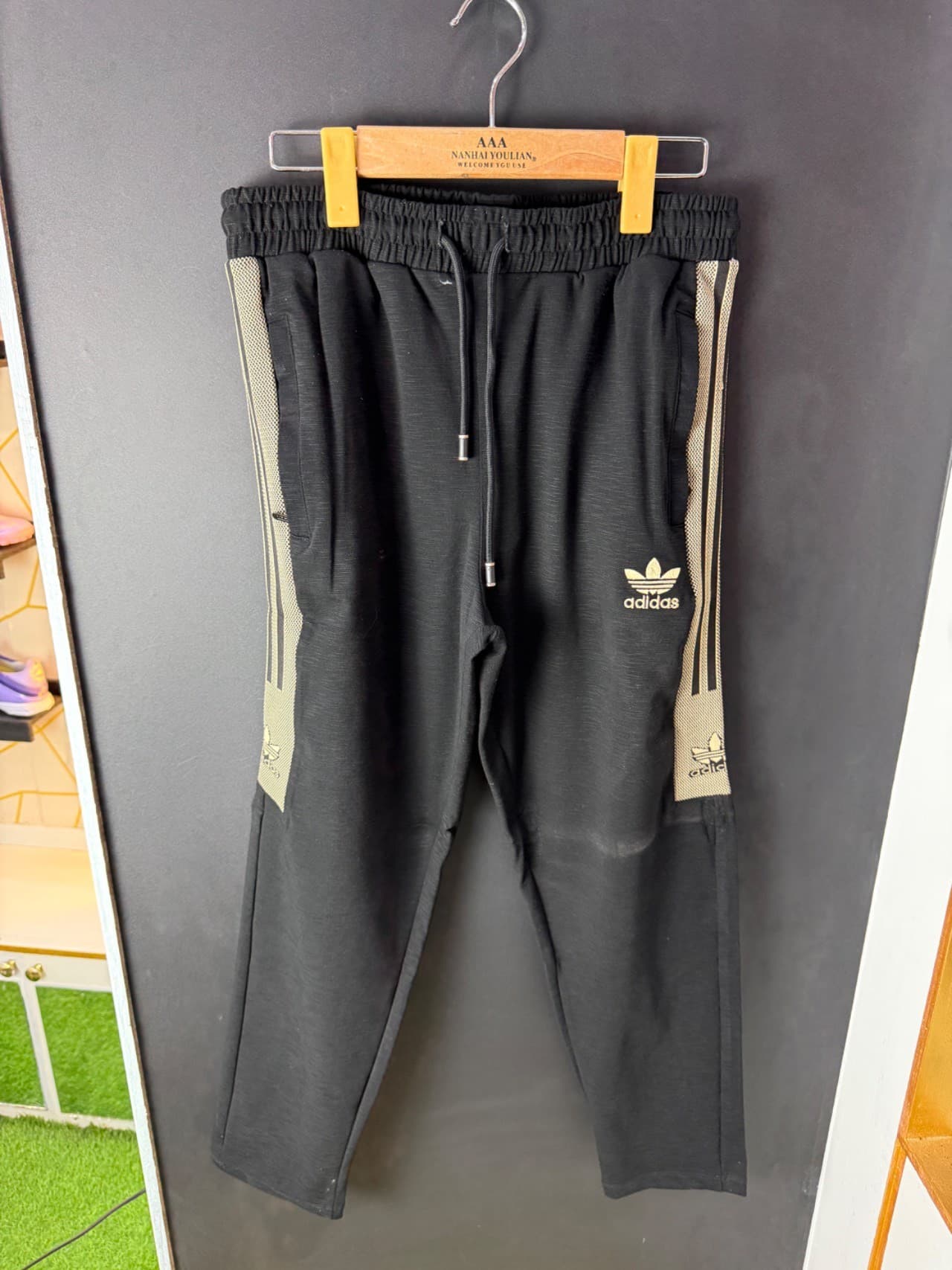Trouser with golden stripes